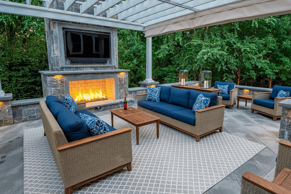 Outdoor living area with seating and fireplace design